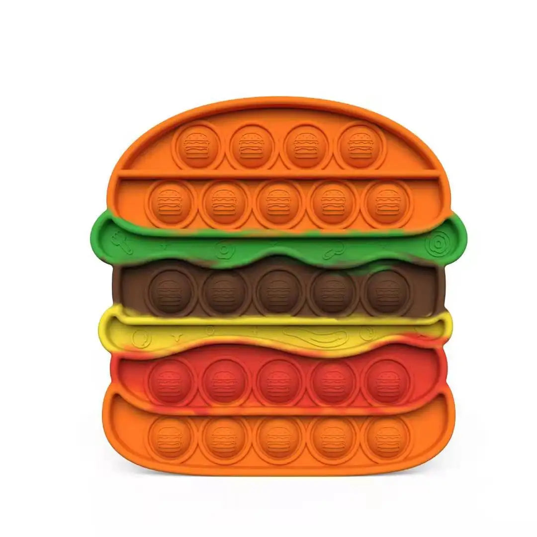 Experience ultimate sensory satisfaction with the Rainbow Pop Fidget Stress Toy by FidgetFuns. Shaped like a hamburger, it features layers adorned in vibrant colors—orange bun, green lettuce, brown meat, yellow cheese, and red tomato—with circular pop-able bubbles for stress relief.