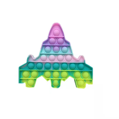 The FidgetFuns Rainbow Pop Fidget Stress Toy – Push Bubble Dimple, shaped like a space shuttle and featuring a gradient of pink, purple, blue, green, and yellow colors, provides delightful sensory satisfaction and is perfect for stress relief.