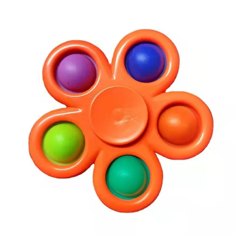 The Rainbow Pop Fidget Stress Toy by FidgetFuns, shaped like an orange flower with six colorful bubbles in purple, blue, green, and orange, offers stress relief and sensory satisfaction. Displayed against a white background.