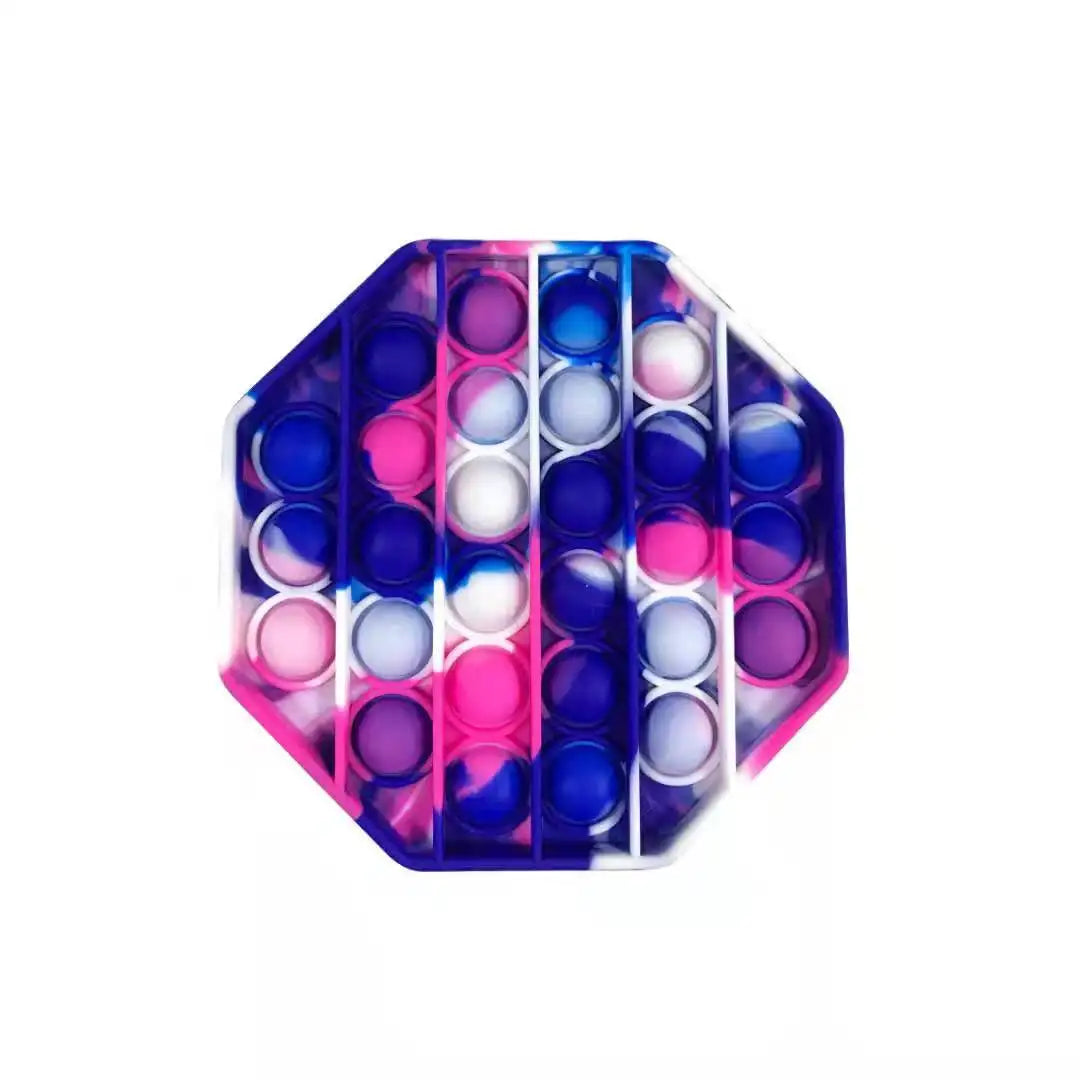 The FidgetFuns Rainbow Pop Fidget Stress Toy features an octagonal design with pink, purple, blue, and white gradient stripes. Its semi-pressed silicone bubbles offer sensory satisfaction for stress relief, all set against a plain white background.