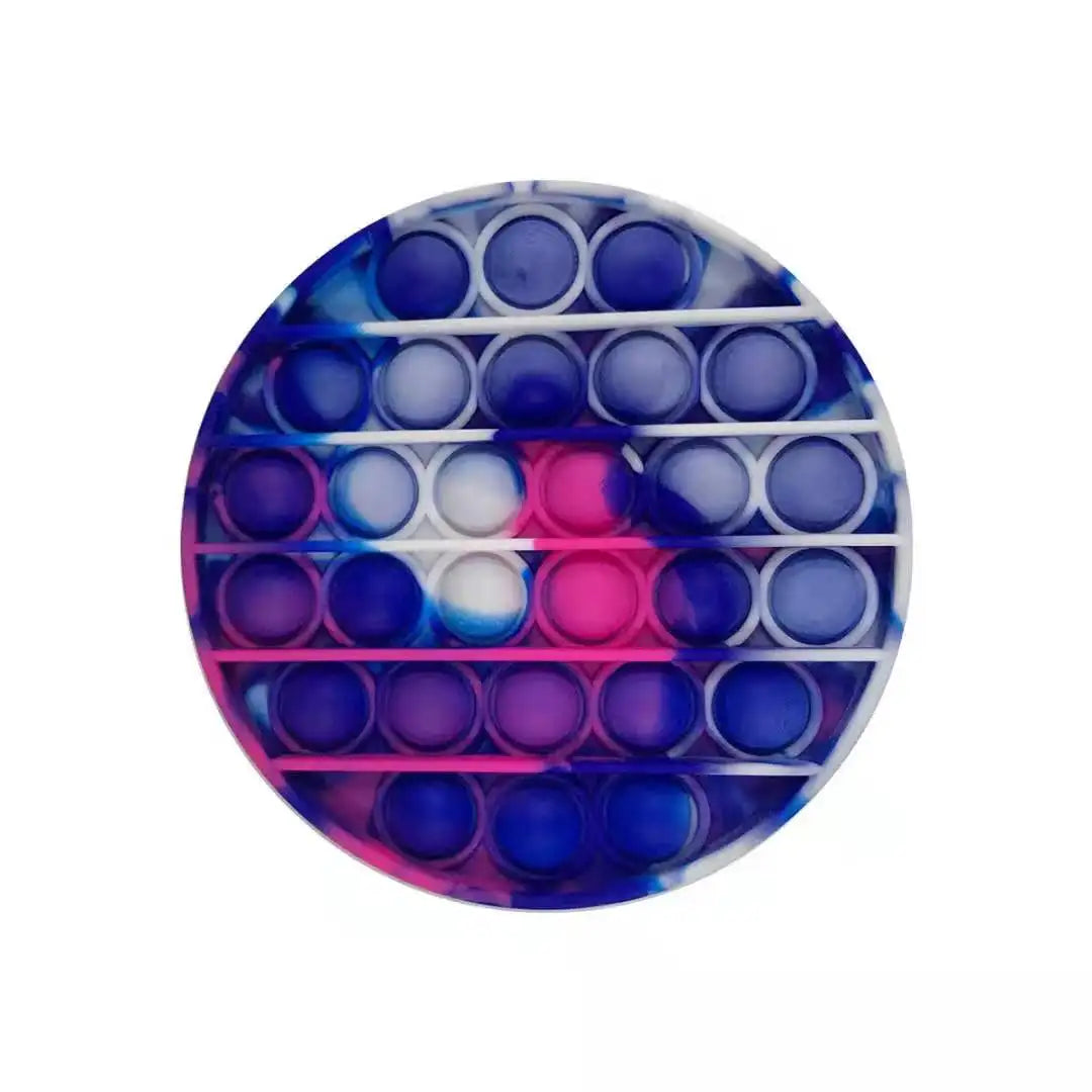 The Rainbow Pop Fidget Stress Toy by FidgetFuns is a round blend of blue, pink, and white silicone bubbles arranged in concentric circles for a vibrant, sensory stress relief experience.